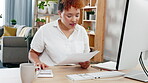 Black woman, accountant and audit in remote work with coffee by computer desk relaxing at home office. African American freelancer in accounting with calculator and documents by PC with cup of drink