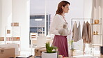 Small business, storage check and package of a woman entrepreneur with startup company. Designer, clothing retail and shipping box with a female worker doing an inventory and distribution order