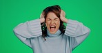 Woman, green screen and frustrated with pulling hair in studio for mental health, anxiety and shouting. Angry model, stress and psychology problem with trauma, bipolar or schizophrenia by background