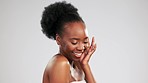 Black woman, face and beauty, skincare and facial with healthy skin and glow on studio background. Natural cosmetics, smile and mockup space, dermatology and cosmetic care with happy female and hand