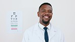 Portrait of black man, doctor and eye test with smile in clinic or vision and eyesight in Africa. Healthcare, wellness and happy expert optician with reading exam for eyes, health and sight in clinic