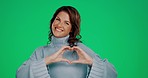 Heart, green screen and portrait of a woman with a hand sign isolated on a studio background. Happy, friendly and a mature lady showing an emoji gesture for love, care and kindness on a backdrop