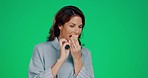 Happy, green screen and eating woman with a cupcake isolated on a studio background. Food, smile and mature lady enjoying a sweet treat, dessert or cake for a snack on a mockup backdrop with space