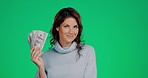 Happy, face and woman with money in a studio from winning an online bet for financial freedom. Happiness, smile and portrait of a female model fanning her with cash by a green screen background.