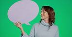 Social media, speech bubble and mockup with a woman on a green screen background in studio for an announcement. Portrait, communication and news with an attractive young female holding a blank sign