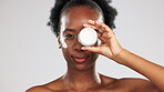 Face, skincare and black woman with cream container in studio isolated on a gray background. Dermatology portrait, cosmetics and happy female model with lotion, creme or moisturizer for skin health.