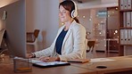 Headphones, music and business woman dancing at computer for mental health, office wellness and energy at night. Professional person or happy employee dance, listening to rock audio at job desktop