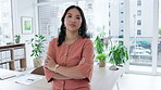 Asian woman, face and arms crossed in business leadership or corporate management at office desk. Portrait of confident and proud female manager or strong leader in empowerment at the workplace