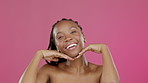 Black woman, hands or touching face on isolated pink background in skincare glow, self love or healthcare aesthetic. Smile, happy or beauty model portrait and natural makeup cosmetics or studio pride