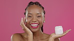 Laughing black woman, face and beauty cream on isolated pink background in healthcare, wellness or skincare grooming. Smile, portrait and model portrait and lotion product or facial makeup cosmetics