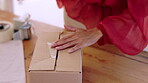 Woman, hands and box, packing package and e commerce, small business with distribution and logistics. Company owner, supply chain and seal parcel with tape, retail  and product with online shopping