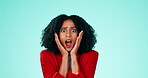 Face, shock and surprise with a black woman in studio on a blue background looking amazed in awe. Portrait, wow and omg with an attractive young female saying wtf while feeling shocked or surprised