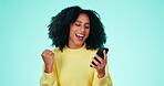 Yes, winning and phone of black woman isolated on a green background fist pump, celebration or competition winner. Excited, wow person on smartphone, cellphone or mobile app bonus, sale or good news