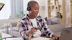 Black woman, laptop and credit card in remote work for telemarketing, ecommerce or online shopping at home. Happy African female freelancer consultant agent working on computer for internet banking