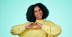Heart, hands and portrait of black woman in studio, background and color backdrop. Happy female model with finger shape for love, thank you and smile in support of peace, emoji and care for kindness