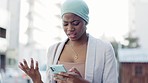 Black woman in city, angry and smartphone with connection, confused and upset in town. African American female, lady and cellphone for communication, reading email and frustrated outdoor and stress