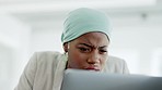 Confused, laptop and black woman reading in the office while doing research for a corporate project. Annoyed, technology and professional female employee working on a company report in the workplace.