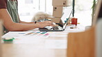 Woman, hands and laptop in fashion small business typing for online marketing, advertising or design at office desk. Hand of female clothing designer working on computer in logistics at workshop