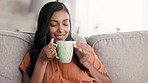 Coffee, black woman and morning drink feeling calm and relax on living room sofa. Tea smell, lounge and aroma in a home with a young person with happiness, smile and peace on the weekend in a house