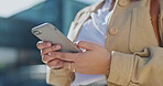 Hands, social media and person scrolling on phone searching the internet, web or website outdoors in a city. Closeup, 5g and person online browsing on app for information on cellphone or smartphone