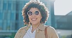 Happy, smile and woman with sunglasses in city while on a vacation, adventure or weekend trip. Happiness, travel and portrait of female sightseeing or exploring urban town while on holiday in Mexico.