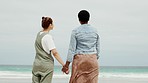 Holding hands, sea and couple of friends by the beach with lgbt love and lesbian support outdoor. Happiness, ocean date and women back of young people in nature on summer travel and vacation