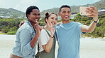 Peace sign, selfie and smile with friends at beach for bonding, summer break and social media post. Happy, community and support with group of people in nature for picture, vacation and technology