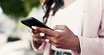 Woman, phone and hands typing in the city for chatting, texting or business idea outdoors. Hand of female in communication on smartphone for chat, text or social media in the street of an urban town