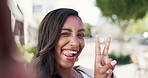 Woman, face and peace sign for selfie in city in social media, vlog or profile picture on the street. Happy female vlogger in travel smiling for photo, emoji or online post for memory in a urban town