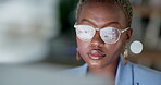 Face, black woman and glasses reflection on computer in night business, online research or planning strategy. Serious female worker reading desktop technology while working late on internet in office