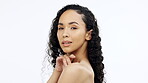 Face, beauty and skin with a model black woman touching her shoulder in studio on a gray background. Portrait, skincare and sensual with an attractive young female feeling her smooth or soft body