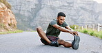 Fitness, man and stretching legs on mountain in preparation for running exercise or workout in nature. Active male in warm up leg stretch getting ready for cardio run, exercising or hiking outdoors