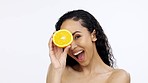 Orange fruit, skincare and face of happy woman in studio, clean wellness and white background. Beauty model, laughing portrait and citrus of vitamin c, natural detox and healthy aesthetic dermatology