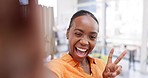 Selfie, smile and face of black woman in office with emoji, comic and funny expression in workplace. Business, corporate worker and portrait of happy female take picture for professional social media