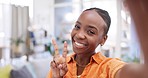 Selfie, smile and face of black woman in office with emoji, peace sign and happy expression in workplace. Business, corporate worker and portrait of happy female take picture for social media update