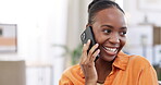 Phone call, smile and conversation with a black woman in her home, chatting or laughing in the living room. Mobile, contact and laughter with a funny young female chatting while in her house to relax