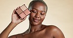 Black woman, face and makeup palette, cosmetic care and beauty product, eyeshadow or foundation on studio background. Eyes closed, female model and cosmetics, powder and skin glow, smile and content