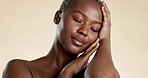 Skincare, beauty and black woman touch face for facial treatment, wellness and cosmetics in studio. Dermatology, spa aesthetic and portrait of African girl with glowing, healthy and natural skin