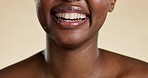 Closeup, black woman and dental care with smile, teeth whitening and girl against a studio background. Zoom, female and lady with clean mouth, oral health and cosmetics for wellness and happiness