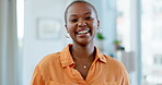 Portrait, happy and zoom with a business black woman at work, standing in her office feeling cheerful or carefree. Face, smile and confidence with a young african american female employee at work