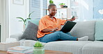 Laptop, online shopping and ecommerce with a black woman customer holding a credit card in her home. Computer, payment and banking with a female consumer using the internet to search a retail sale