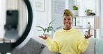 Video podcast, social media influencer and black woman with ring light talking on a sofa. Excited digital communication, greeting and phone streaming online for web audience in a home living room