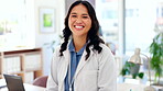 Portrait, healthcare and a doctor asian woman in her office in a hospital looking happy about treatment. Medical, trust and smile with a female medicine professional working in a clinic for insurance