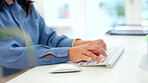 Business woman, hands and computer typing on keyboard for email, communication or networking at office desk. Hand of female employee working on desktop PC for planning, tasks or research at workplace