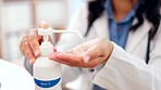 Hand sanitizer, doctor and woman cleaning hands for hospital, healthcare and wellness work. Protection, health and medical washing for virus prevention and safety disinfection in a covid clinic