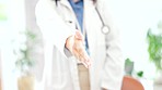 Woman, doctor and handshake for meeting, greeting or introduction for healthcare appointment at hospital. Hand of female medical professional shaking hands, emoji or sign for deal agreement at clinic