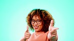 Happy, positive and portrait of a woman with finger guns isolated on blue background in studio. Smile, happiness and young girl with expression, excitement or gesturing for a cool sign on a backdrop