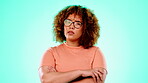 Portrait, thinking and a black woman in studio on a blue background standing arms crossed in contemplation. Idea, problem solving and wonder with an attractive young afro female looking thoughtful