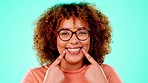 Face, black woman and pointing to mouth, smile and happiness against a blue studio background. Portrait, Jamaican female and lady show to teeth, whitening and happiness with confidence and wellness
