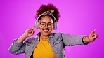 Dance, carefree and woman with headphones for music isolated on a pink background in a studio. Smile, fun and girl listening to an audio, radio or playlist while dancing on a backdrop for happiness